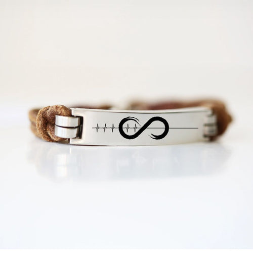 Leather promise bracelet with a silver clasp and engraved promise symbol on a white background.