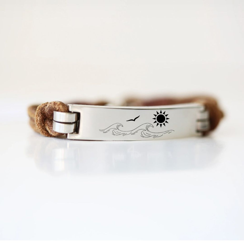 Leather promise bracelet with a silver clasp and engraved promise symbol on a white background.