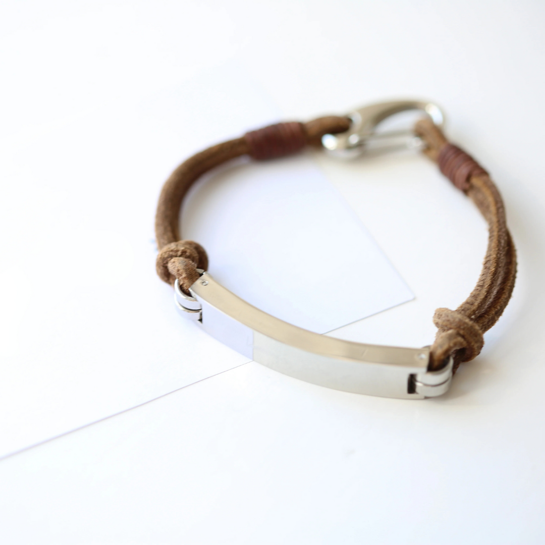 Brown leather promise bracelet with silver clasp.